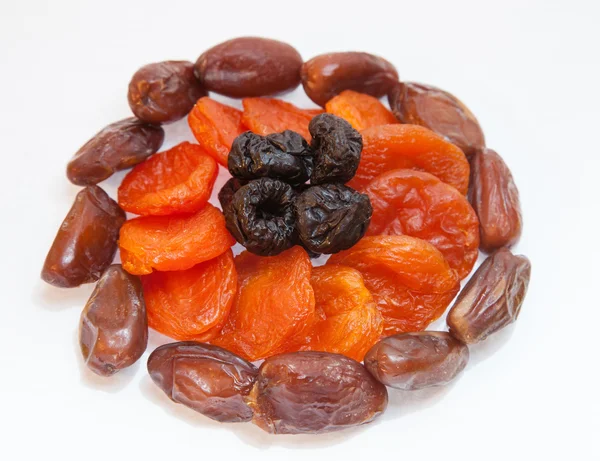 Dried apricots, dates and prunes — Stock Photo, Image