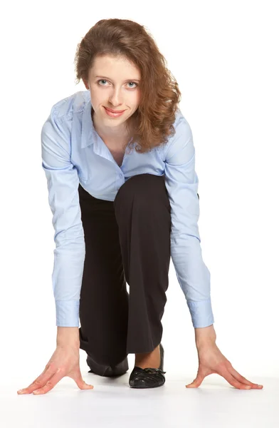 Businesswoman getting ready for race — Stock Photo, Image