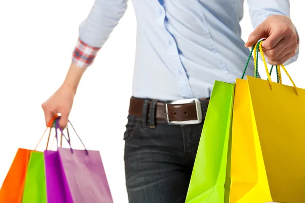 Mujer sosteniendo bolsas de papel de compras multicolores —  Fotos de Stock