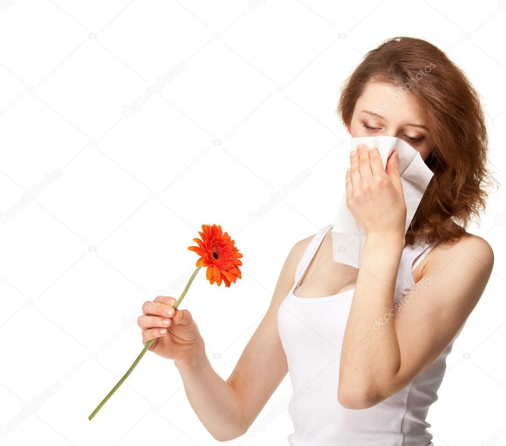 Woman having allergy from spring flowers