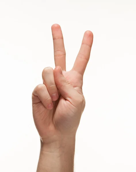 Hand showing victory sign Stock Image