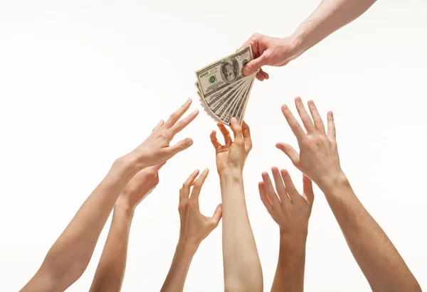 Many hands reaching out for money — Stock Photo, Image