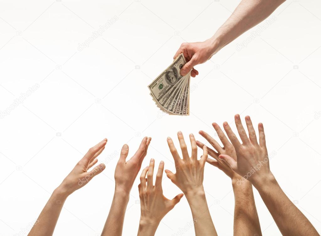Many hands reaching out for money