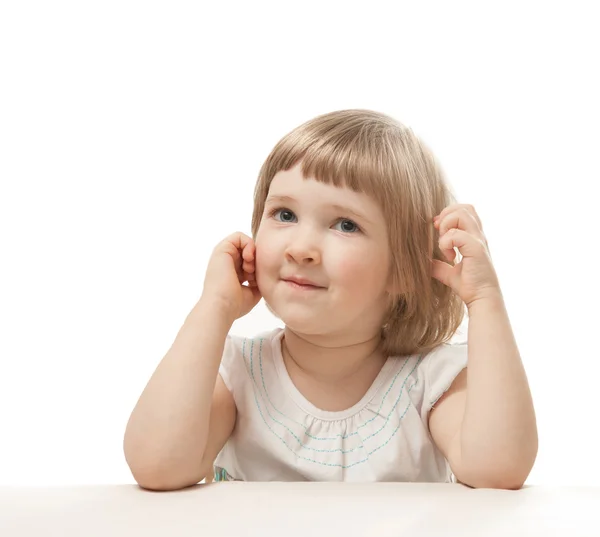 Portrait of little girl sitting at the table — Stock Photo, Image