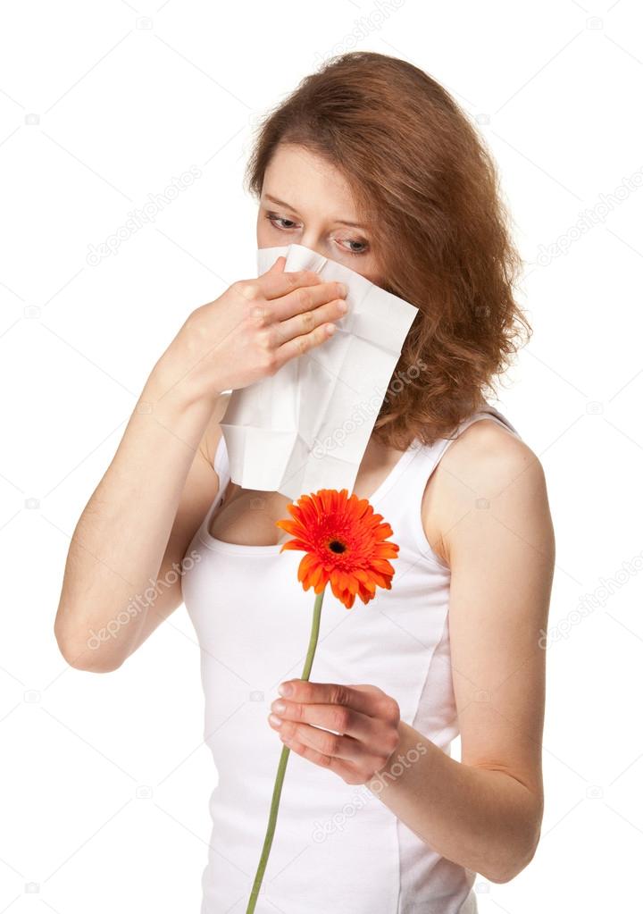 Woman having allergy from spring flowers