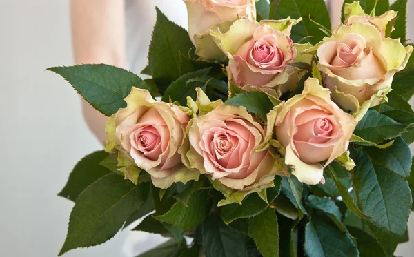 Bunch of flowers in woman's hands — Stock Photo, Image