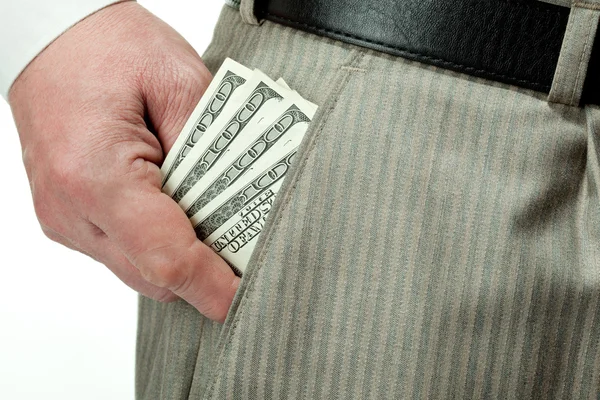 Man's hand nemen geld uit eigen zak — Stockfoto
