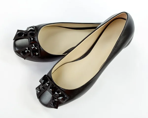 Paar zwarte platte schoenen — Stockfoto
