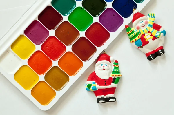 Colorful paints set and new year toys — Stock Photo, Image