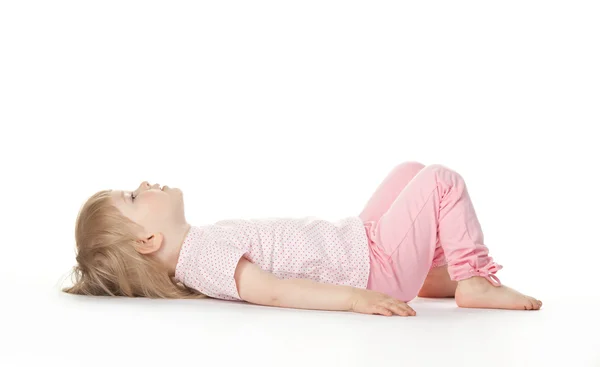 The baby girl is lying on the floor — Stock Photo, Image