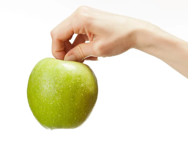 人类只手握住新鲜的青苹果 — 图库照片