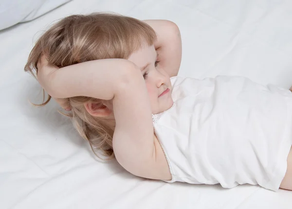 Morning exercises in the bed — Stock Photo, Image