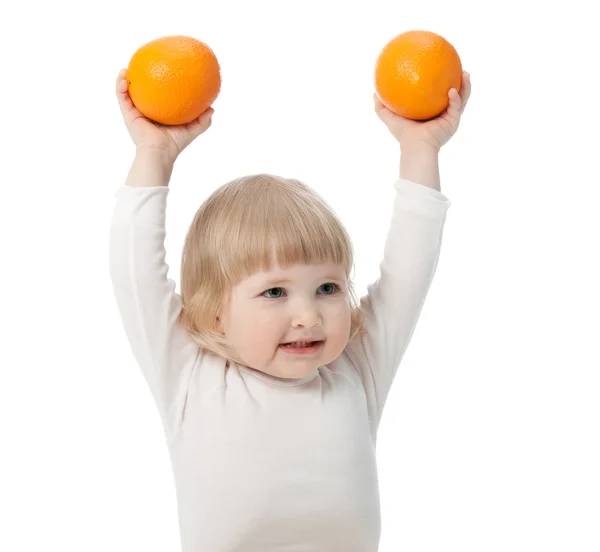 The baby girl with oranges — Stock Photo, Image