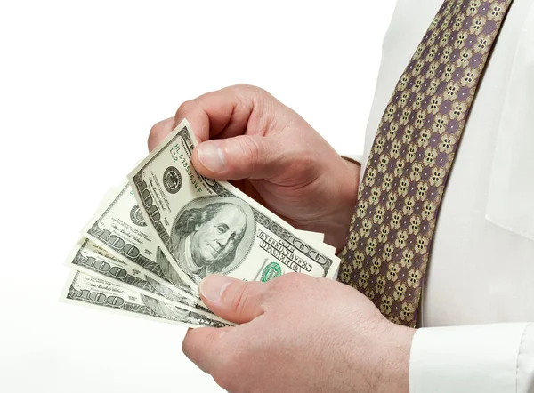 Affärsmannens händer räknar dollar sedlar — Stockfoto