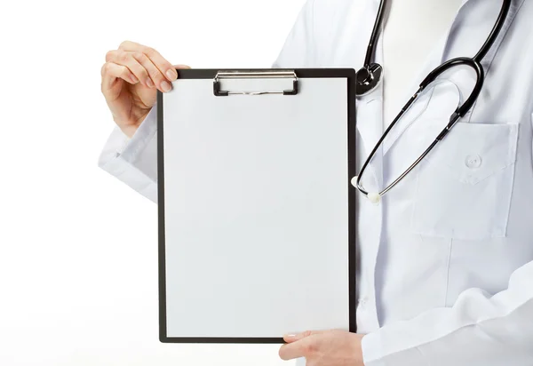 Doctor's hands holding clipboard with blank sheet of paper Stock Photo
