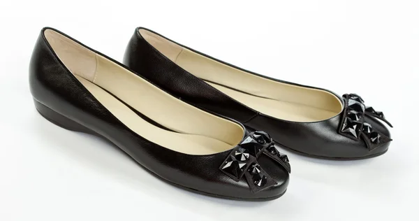 Paar zwarte platte schoenen — Stockfoto