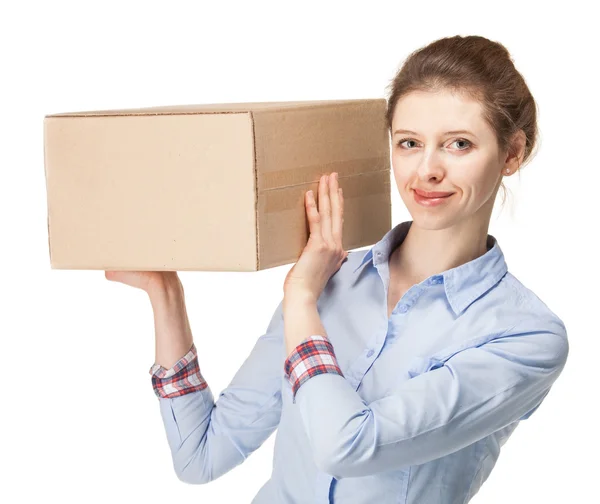 Smiling young woman carrying a big box — Stock Photo, Image