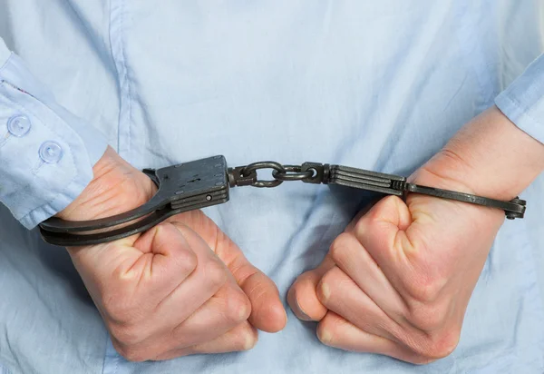 Hands in handcuffs — Stock Photo, Image