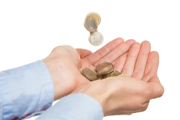 Pouring coins in woman's hands — Stock Photo, Image