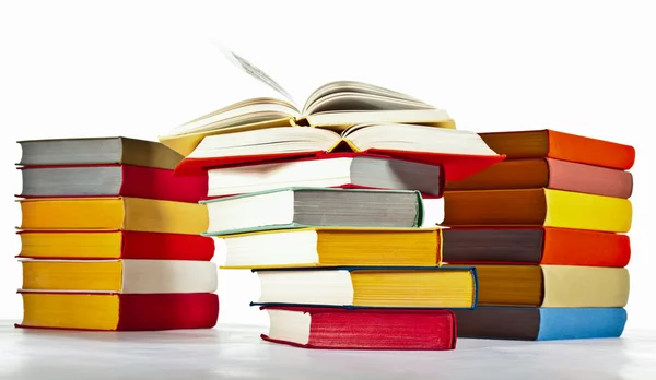 Many multicolored stacked books — Stock Photo, Image