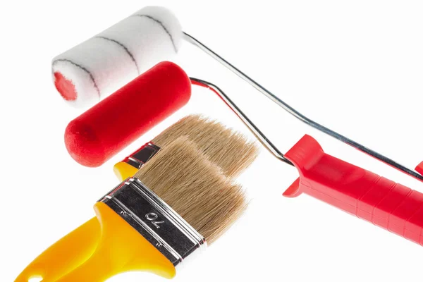 Construction paintbrushes and paint rollers — Stock Photo, Image