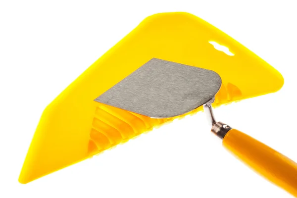 Plastic putty knife and plastering trowel — Stock Photo, Image