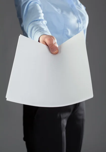 Hand reaching out blank documents — Stock Photo, Image