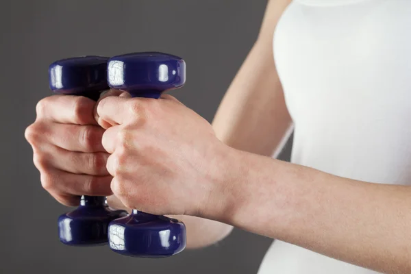 Woman doing exercises with dumbbells — Stock Photo, Image