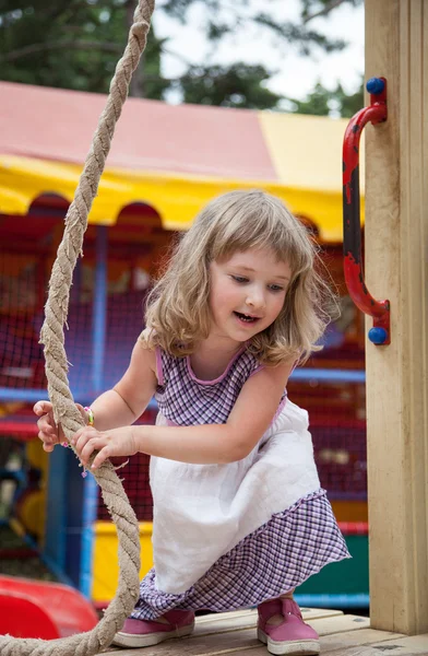 Active little girl playing with rope in a stadium — Stock Photo, Image