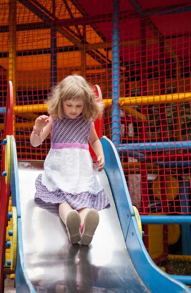 Little girl on a slide — Stock Photo, Image