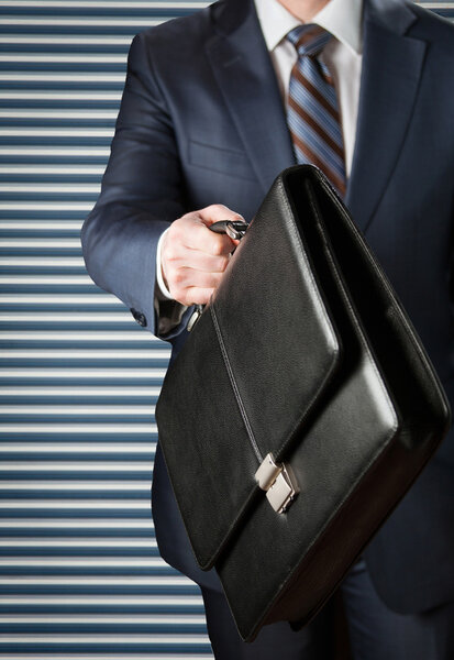 Businessman walking with a briefcase