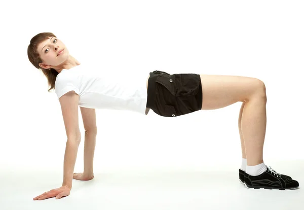 Chica delgada haciendo ejercicios deportivos —  Fotos de Stock