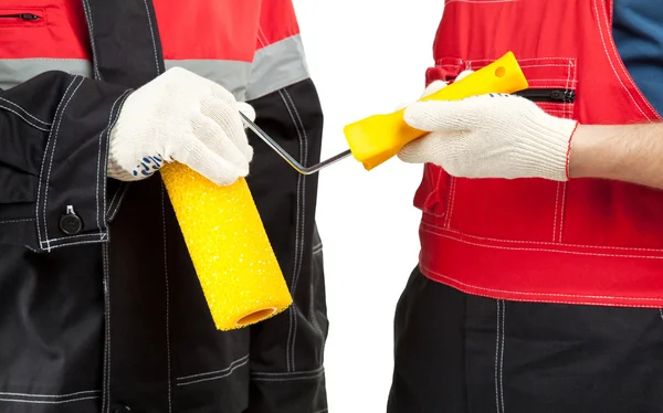 Painters holding paint roller — Stock Photo, Image