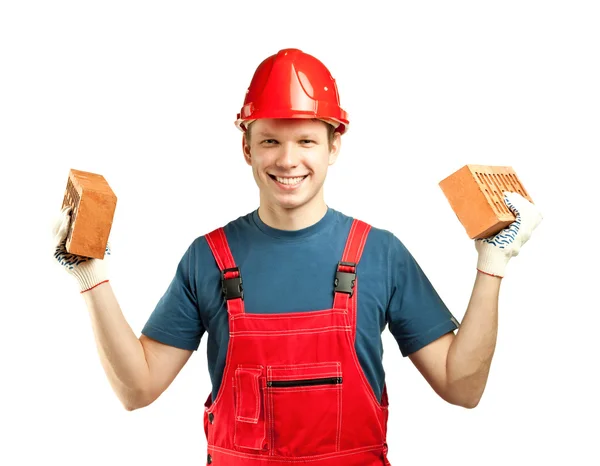 Cheerful builder holding bricks — Stock Photo, Image