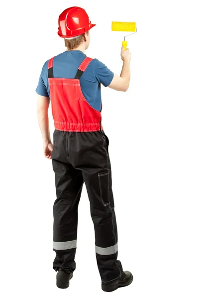 Pintor em uniforme trabalhando com rolo — Fotografia de Stock