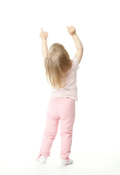 Pequena menina mostrando algo acima dela — Fotografia de Stock