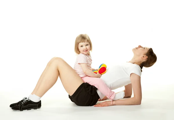 Mother doing sport exercises with her daughter — Stock Photo, Image