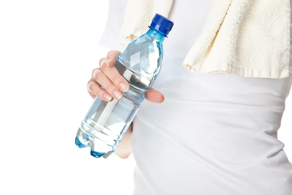 Female hand holding bottle of drinking water — Stock Photo, Image