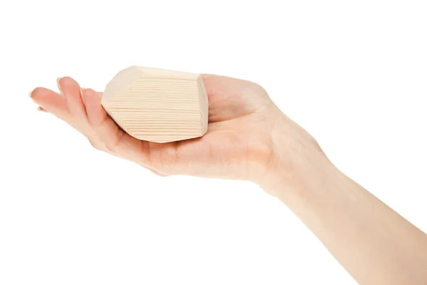 Human hand holding wooden block — Stock Photo, Image