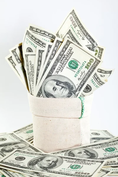 Many dollar banknotes in a sack — Stock Photo, Image