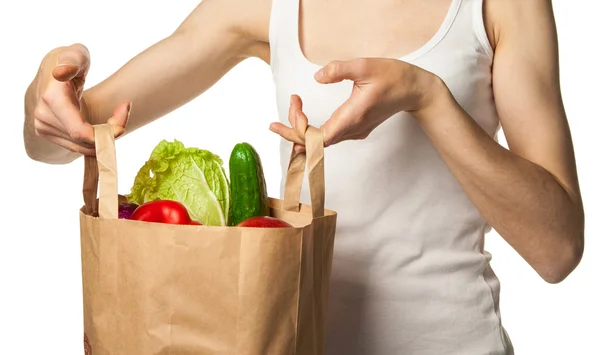Woman's hand holding vegetables and fruits in shopping bag — Stock Photo, Image