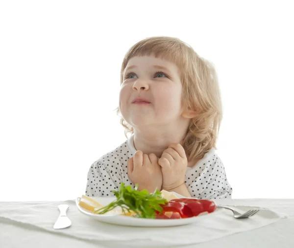 Hübsches kleines Mädchen isst, isoliert auf weiß — Stockfoto