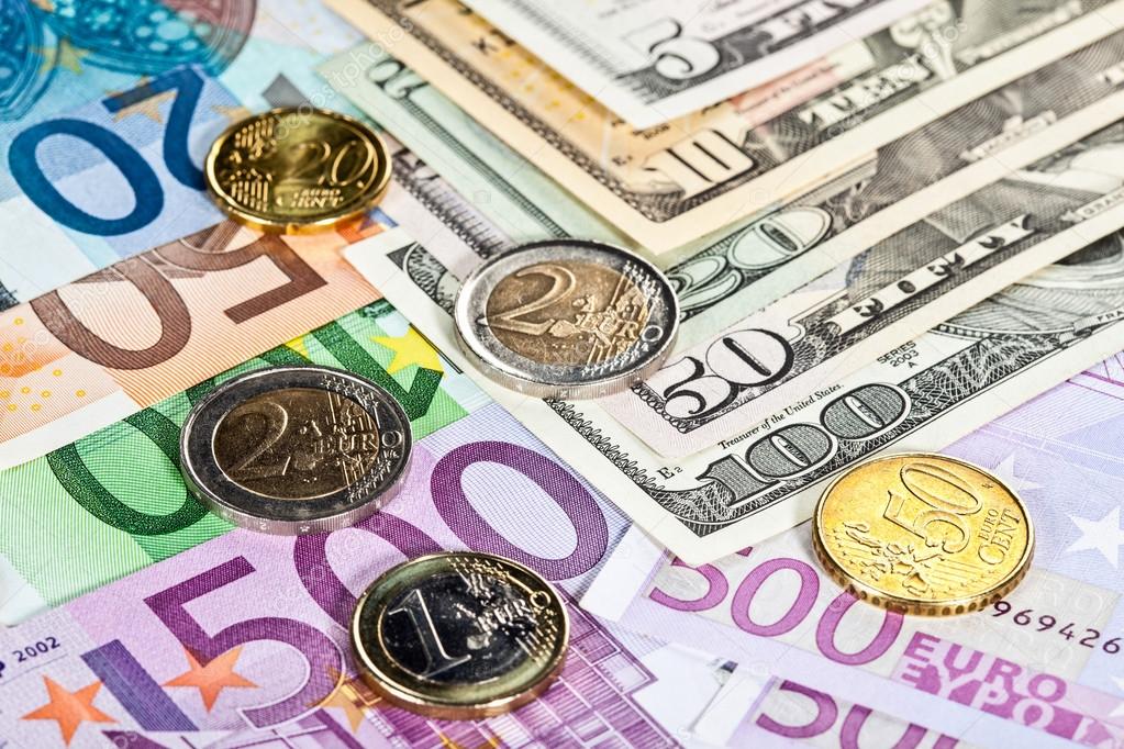 Many euro and dollar banknotes and coins