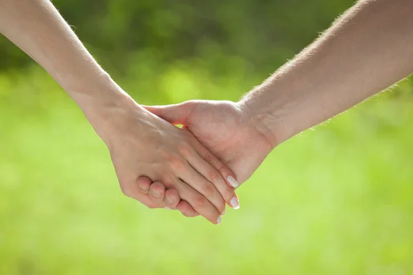 Hands of man and woman holding together — Stock Photo, Image