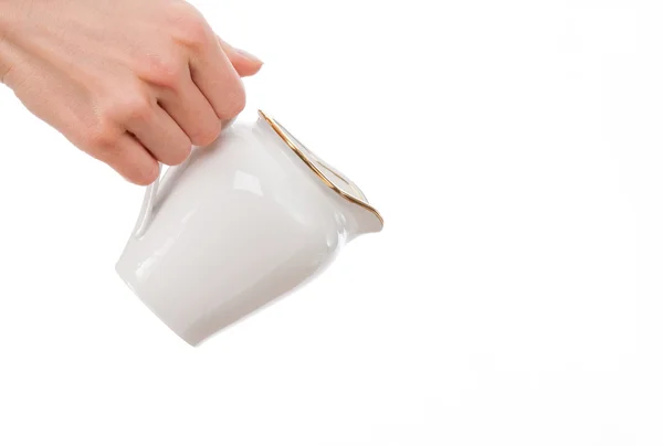 Woman's hand holding milk jug — Stock Photo, Image