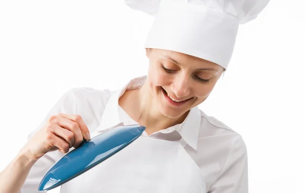 Chef cook peeping in saucepan — Stock Photo, Image