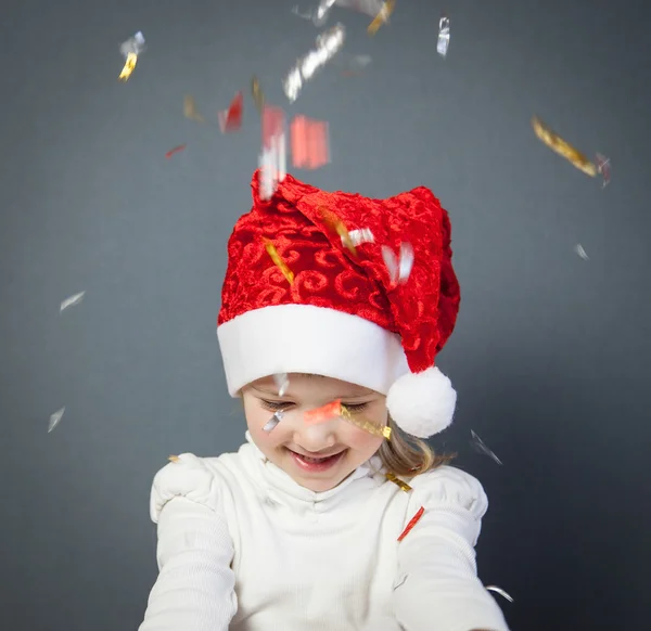 Portrait of a charming little girl in Santa's hat — Stock Photo, Image
