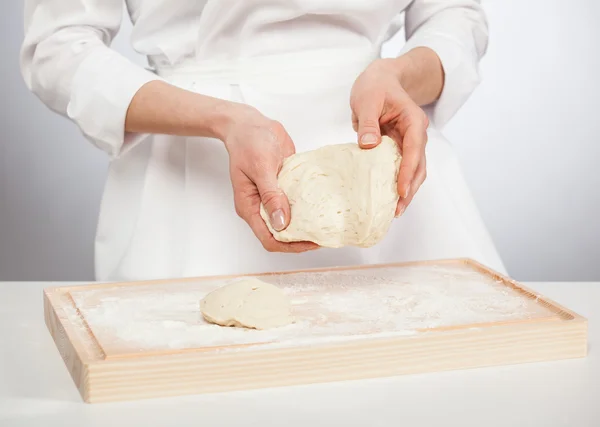 Cook's hands kneading dough — Stock Photo, Image