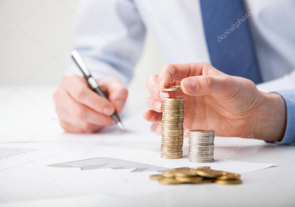 Business people calculating profit
