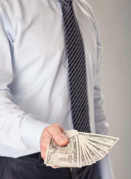 Businessman giving banknotes to you — Stock Photo, Image